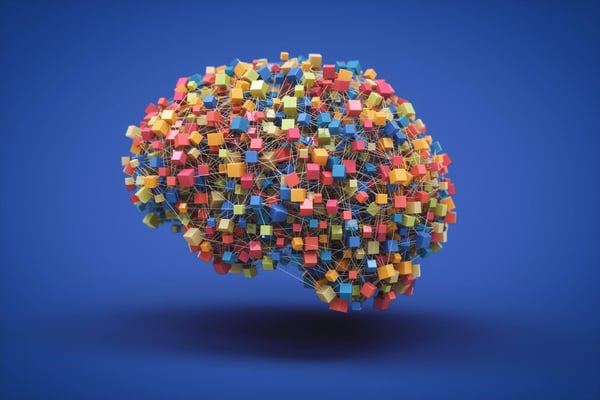 Network of interconnected, colorful boxes forming the shape of a human brain on a rich purple background. Illustrates the complexity and beauty of neural connections and symbolizes the multifaceted nature of the human brain.