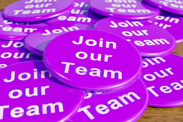 Purple campaign buttons with white lettering that says Join our Team