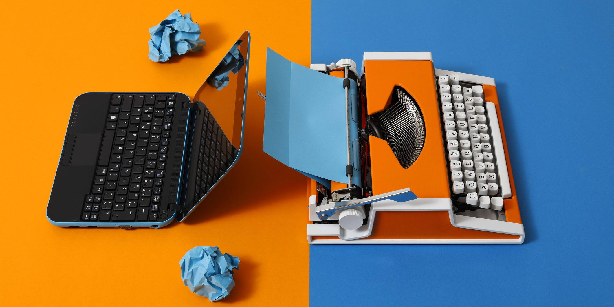 Picture of a laptop and 70s typewriter represents the benefits of using modern technology