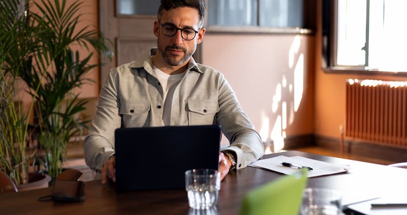 Man in front of his laptop