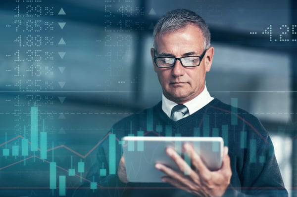 Older businessman looking at a computer tablet