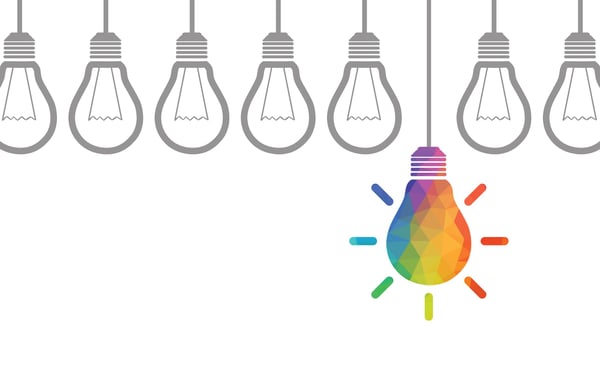 An illustration of row of lightbulbs one stands out because it brightly colored and symbolizes a great idea
