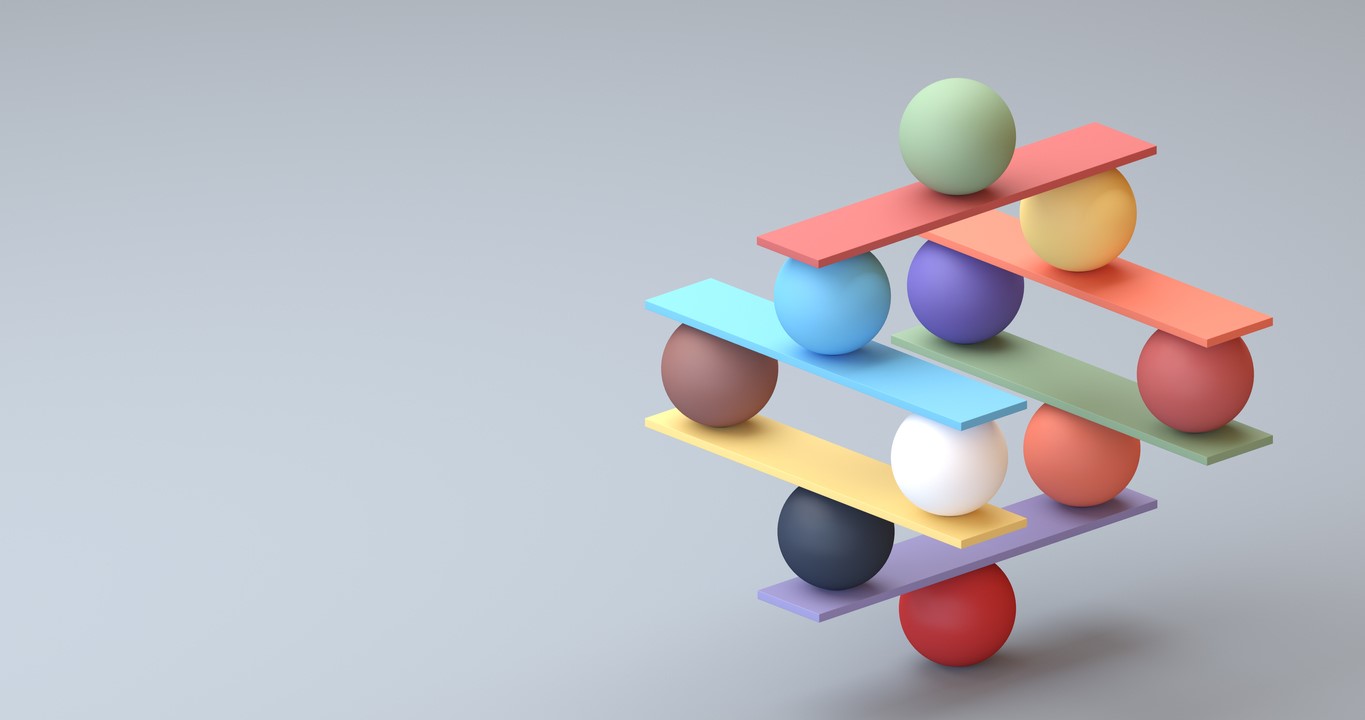 Colorful balls and flat sticks are balanced in a Jenga-like configuration