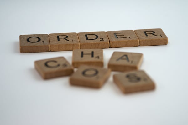Order and chaos printed on scrabble tiles