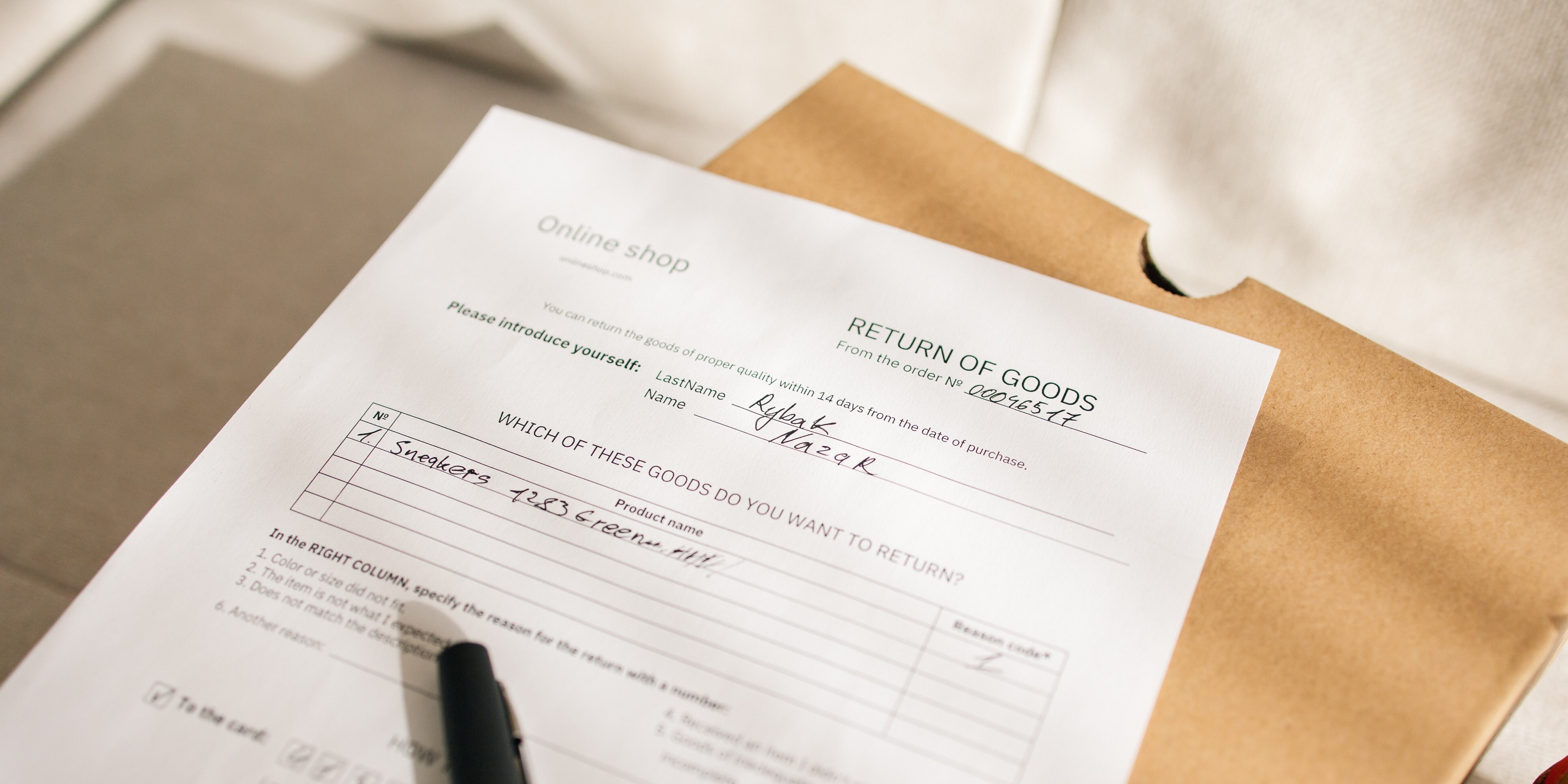 A typed form for an online product return filled out with handwritten text