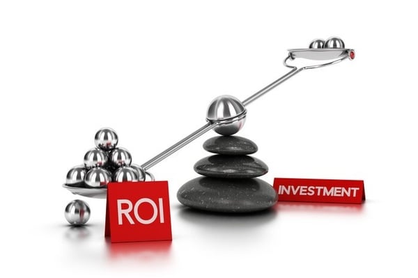 Photo of a scale that represents the balance between investment and return on investment (ROI)