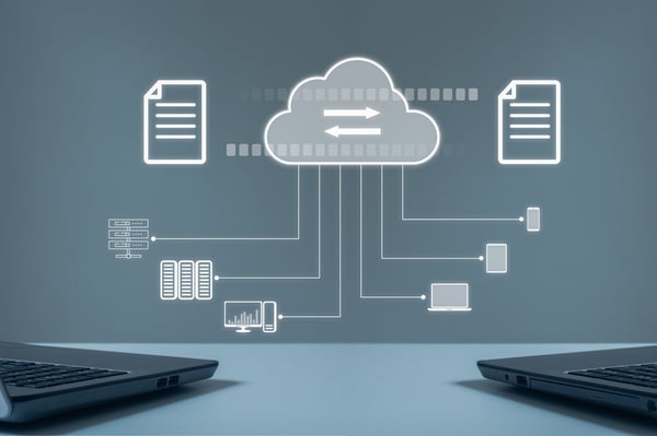 Two computers exchanging files through cloud server